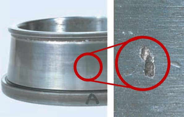 Fig. 3: Flaking of material due to fatigue on the rolling element (inner ring raceway surface of a tapered roller bearing)